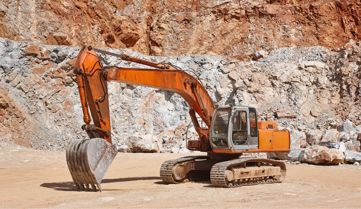 Crawler excavator parked in a quarry